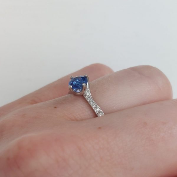 Modern 0.70ct Sapphire and Diamond Twist Setting Ring