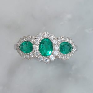 Triple 0.98ct Emerald and Diamond Cluster Ring