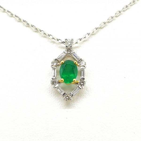 Contemporary 0.72ct Oval Emerald and Diamond Cluster Pendant