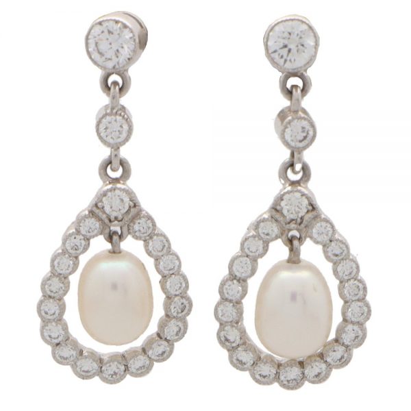 Pearl and diamond drop earrings halo