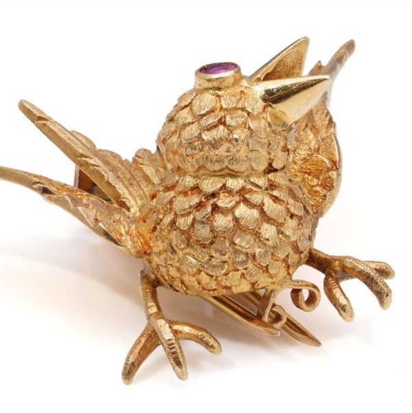 Hermes Gold Bird Brooch with Ruby Eye, carved chiselled feathers