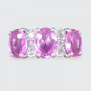 Pink Sapphire Three Stone Ring with Diamond Spacers