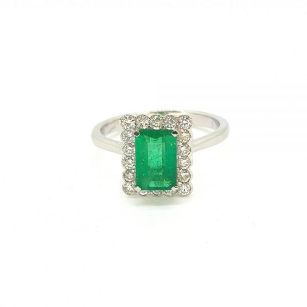 0.95ct Emerald Cut Emerald and Diamond Cluster Ring 18ct White Gold