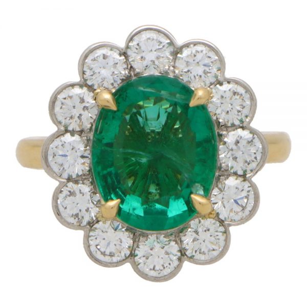 A fine natural 3.42 Carats Emerald and Diamond Cluster Ring