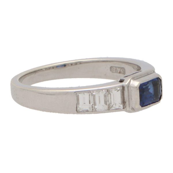 sapphire and diamond ring with three emerald cut diamond shoulders
