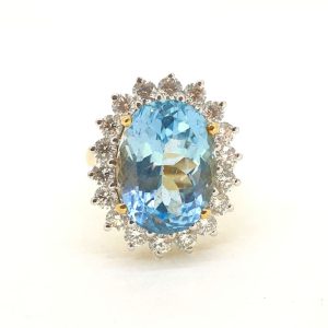 14.28ct Oval Blue Topaz and Diamond Cluster Dress Ring