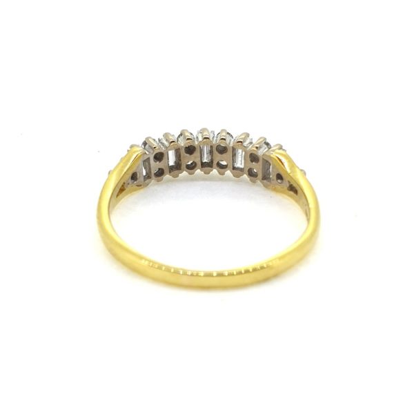 Vintage Baguette and Brilliant Diamond Ring, set with alternating baguette-cut and round brilliant-cut diamonds in 18ct yellow gold, Circa 1989