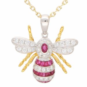 A modern ruby and diamond 18ct yellow and white gold bee pendant