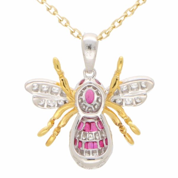 A modern ruby and diamond 18ct yellow and white gold bee pendant