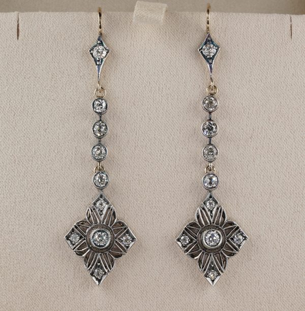 Antique Art Nouveau 2.90ct Old Mine Cut Diamond Drop Earrings, openwork diamond-shaped drops decorated with floral naturalistic detailing suspended from old mine-cut diamond set lines. Circa 1900
