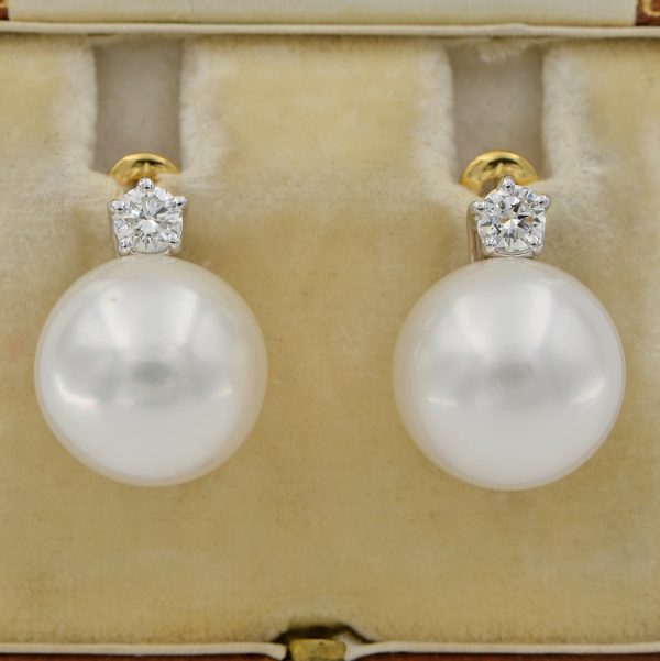 South Sea Pearl and Diamond Earrings, Two large 14.5mm South Sea pearls suspended from sparkling round brilliant-cut diamond solitaire studs in 18ct white and yellow gold