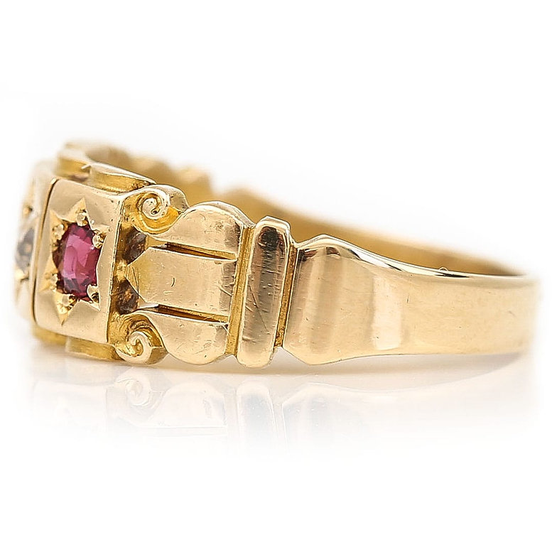 AN UNUSUAL DOUBLE BUCKLE RINGset with rubies and pearls, with 15ct gold  Birmingham 1890 hallmarks. F