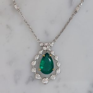 4.85ct Pear Cut Emerald and Diamond Cluster Pendant on Diamond Set Chain