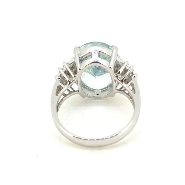 8.58ct Oval Aquamarine Solitaire Ring with Diamond Shoulders, large single stone oval mixed-cut aquamarine in 18ct white gold with decorative swirled shoulders accented with round brilliant-cut diamonds