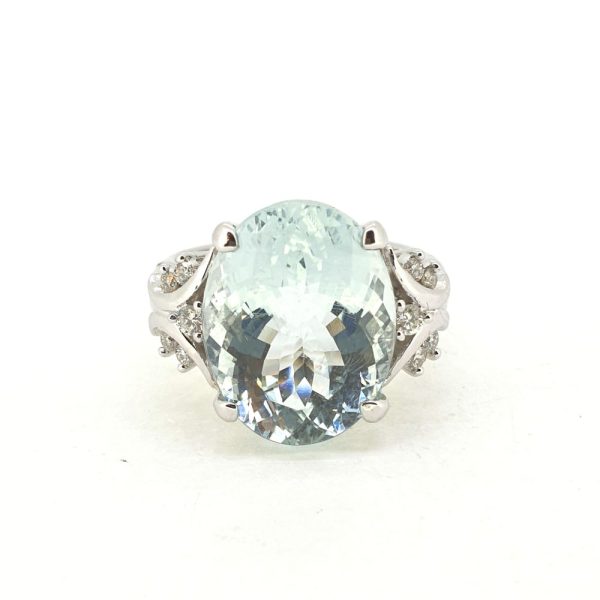 8.58ct Oval Aquamarine Solitaire Ring with Diamond Shoulders, large single stone oval mixed-cut aquamarine in 18ct white gold with decorative swirled shoulders accented with round brilliant-cut diamonds