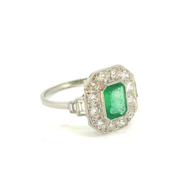 1ct Emerald Cut Emerald and Diamond Cluster Engagement Ring in Platinum with Baguette Shoulders