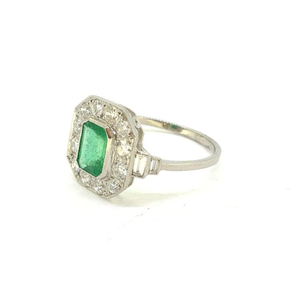 1ct Emerald Cut Emerald and Diamond Cluster Engagement Ring in Platinum