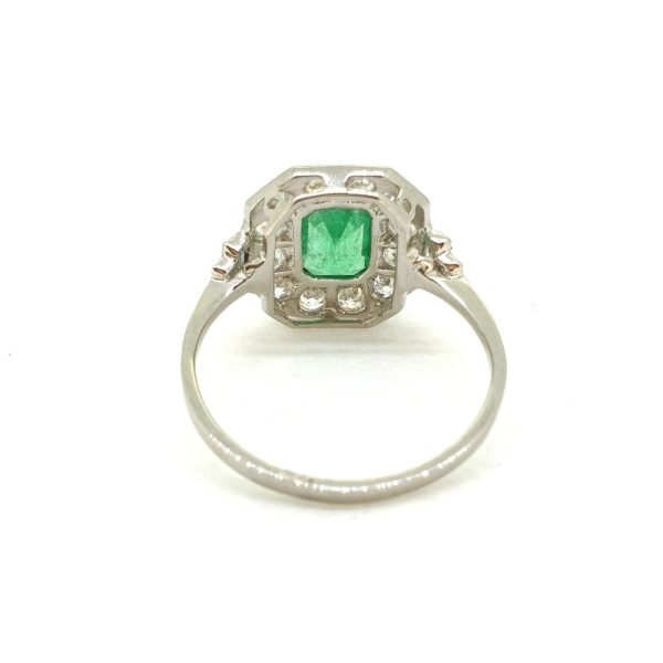 1ct Emerald Cut Emerald and Diamond Cluster Ring in Platinum