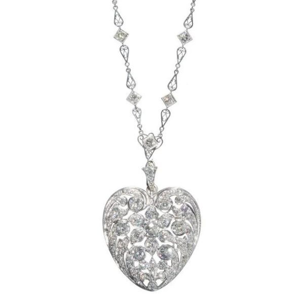 Antique Belle Epoque 12cts Diamond Platinum Heart Pendant and Chain, set with 12 carats of old cut and rose cut diamonds with fleur-de-lys and openwork foliate design on decorative filigree chain with old-cut diamonds in square settings. Circa 1910