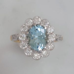 1.50ct Aquamarine and Diamond Cluster Engagement Ring