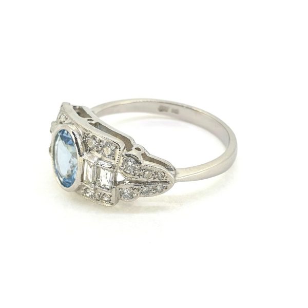 0.70ct Oval Aquamarine and Diamond Cluster Dress Ring in Platinum