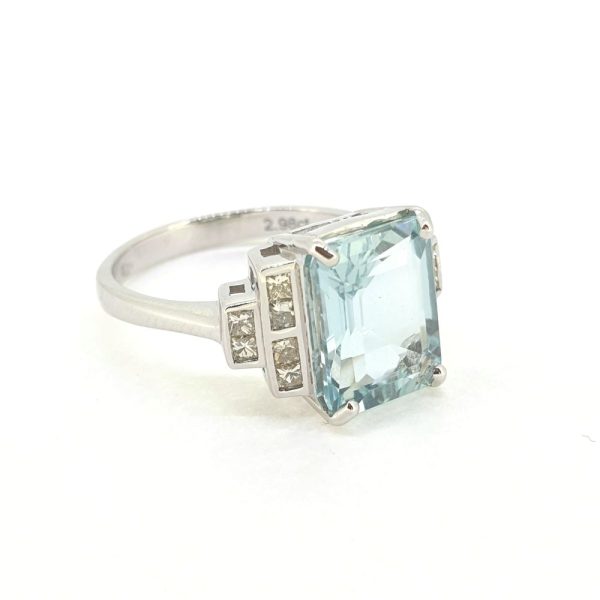 2.98ct Emerald Cut Aquamarine Ring with Princess Cut Diamond Shoulders