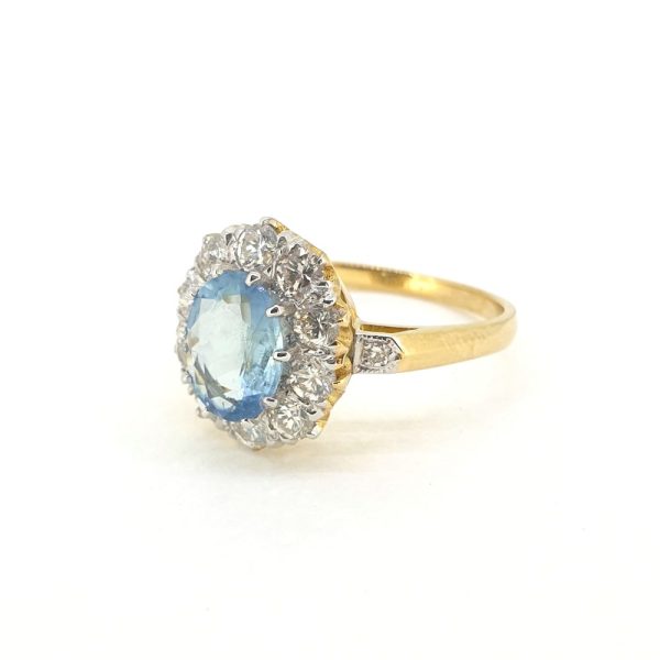 0.80ct Oval Aquamarine and 1.10ct Diamond Cluster Engagement Ring in 18ct Yellow Gold