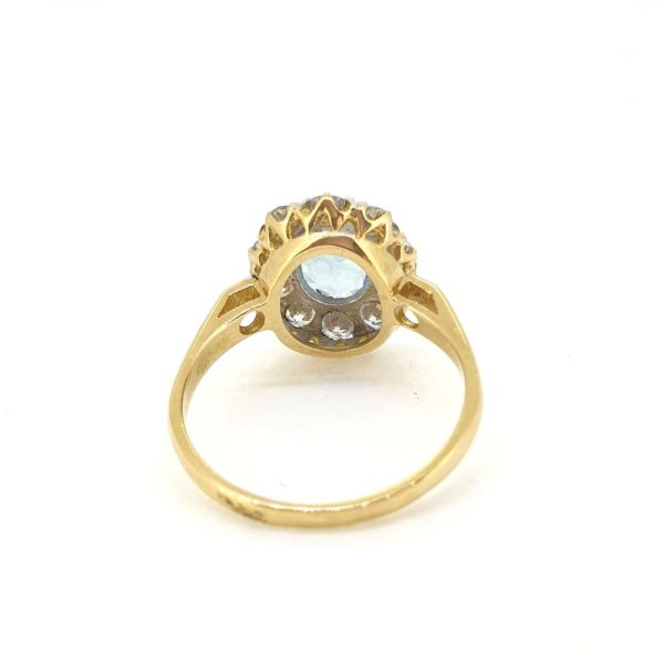 0.80ct Oval Aquamarine and Diamond Cluster Engagement Ring in 18ct Yellow Gold