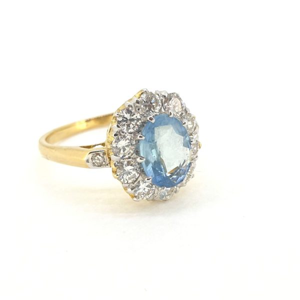 0.80ct Oval Aquamarine and 1.10ct Diamond Cluster Engagement Ring in 18ct Yellow Gold