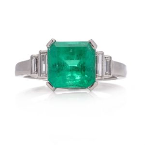Vintage Art Deco style Colombian Vintage Art Deco 3 Carats Colombian Emerald and Diamond Engagement Ring, step cut diamond shoulders