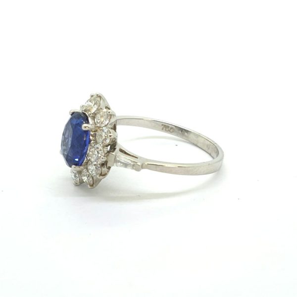2.10ct Oval Sapphire and Diamond Cluster Engagement Ring with tapered baguette diamond shoulders