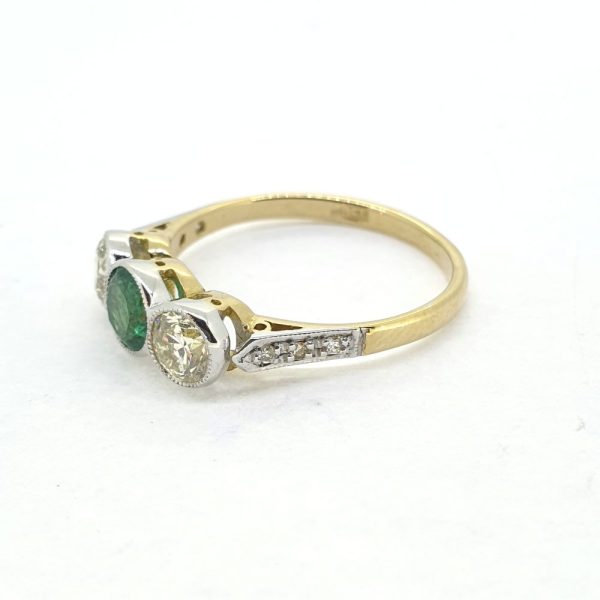 Emerald and Diamond Three Stone Engagement Ring bezel set