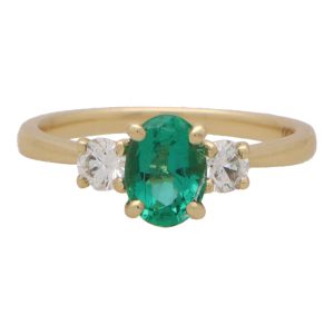Oval Emerald and Diamond Three Stone Engagement Ring