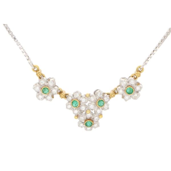 vintage Buccellati Primavera diamond and emerald floral pendant necklace set in 18k white and yellow gold. From the now discontinued Primavera collection, the pendant is composed of a sequence of articulated flowers.