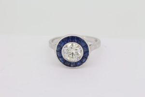 1.21ct Diamond and Calibre Sapphire Target Engagement Ring