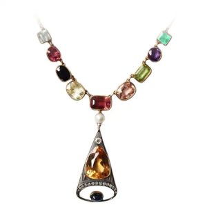 Antique Russian Multi Gemstone Necklace, set with imperial topaz, diamonds, natural pearl, blue pink yellow sapphire, aquamarine, spinel, rubellite, peridot, amethyst and emerald in tri colour 15ct gold. Circa 1890s