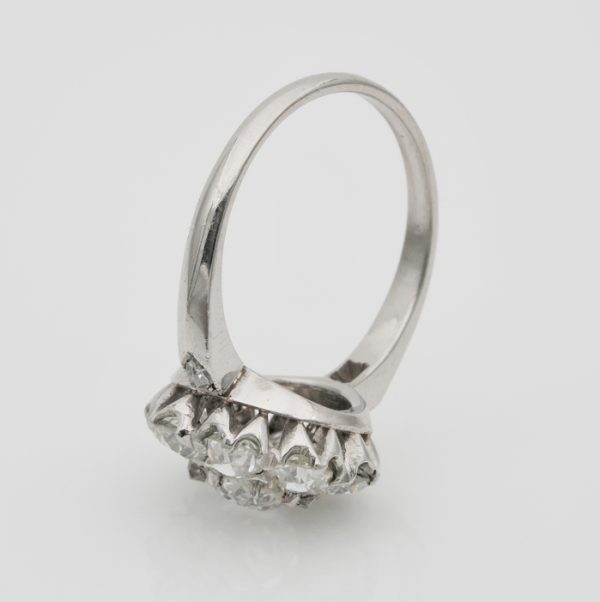 Edwardian Antique 3.15ct Old Cut Diamond Daisy Flower Cluster Engagement Ring in Platinum, 0.95ct cushion-shaped old European-cut diamond surrounded by 2.20cts old mine-cut diamonds, Circa 1910