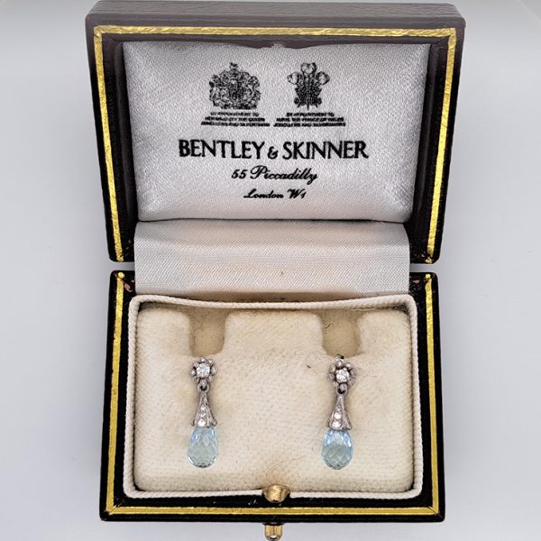 Edwardian Style Briolette Aquamarine and Diamond Drop Earrings by Bentley and Skinner, briolette-cut aquamarine with diamond-set cap suspended from diamond cluster top in platinum