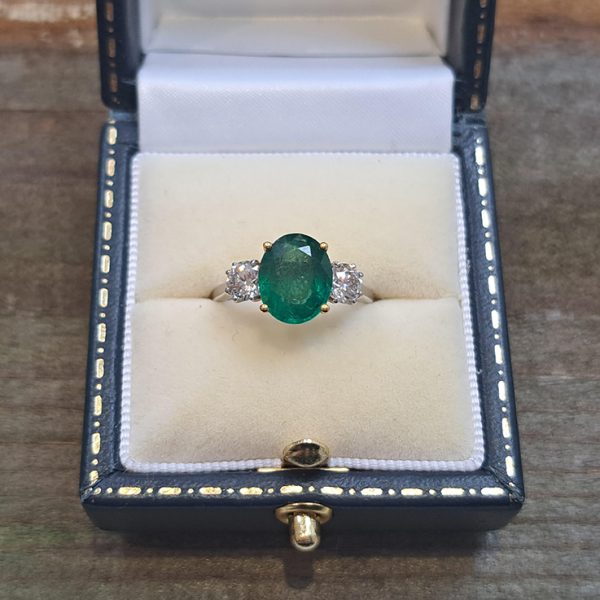2.44ct Oval Emerald and Diamond Three Stone Engagement Ring