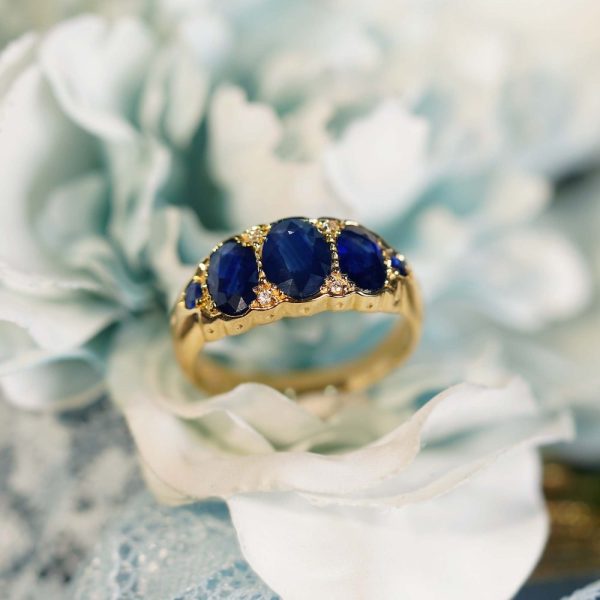 Antique Style Oval Blue Sapphire Three Stone Ring with Diamonds