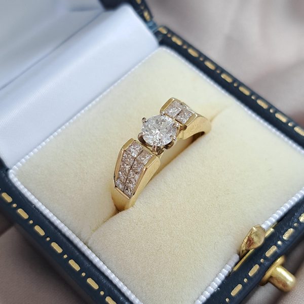 Vintage 0.65ct Diamond Solitaire Engagement Ring with Princess Diamond Shoulders