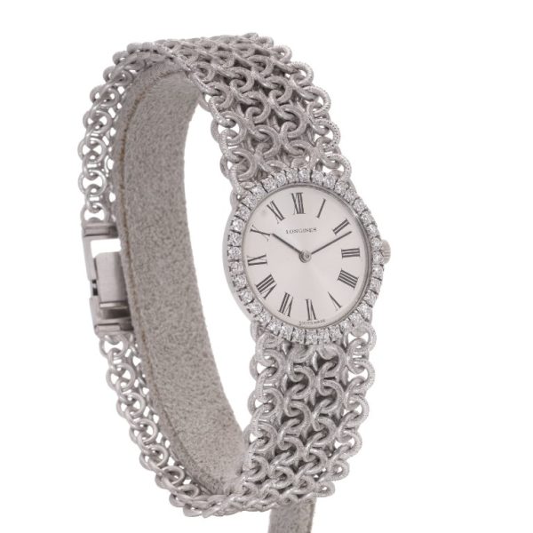 Ladies Vintage Longines 18ct White Gold Watch with Diamond Bezel on a woven design 18ct white gold strap. Circa 1970s
