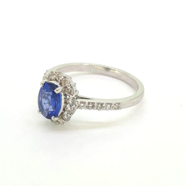 0.75ct Oval Blue Sapphire and Diamond Cluster Engagement Ring
