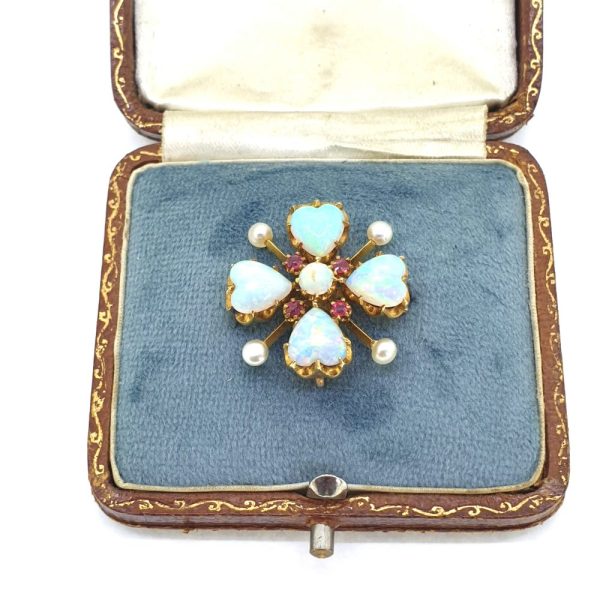 Victorian Antique Heart Cabochon Opal Pearl and Ruby Brooch, four heart-shaped cabochon-cut opals around central opal and ruby cluster accented with pearls in four leaf clover / quatrefoil design