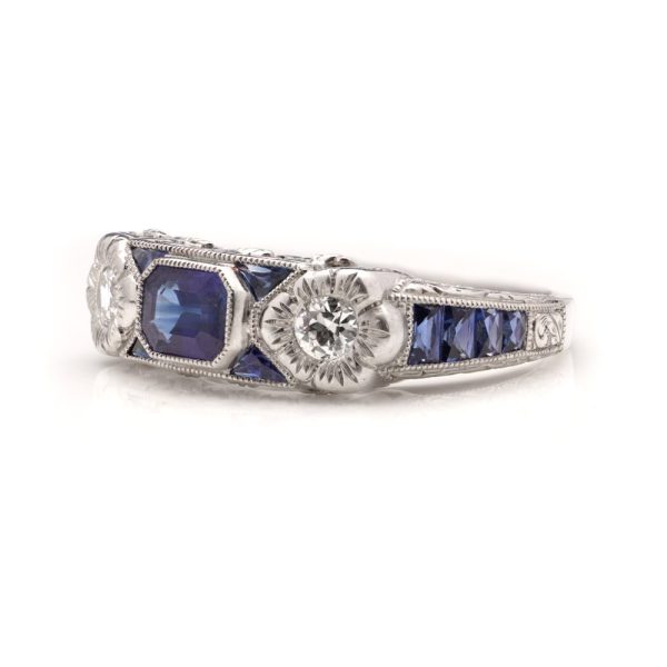0.63ct Emerald Cut Sapphire and Diamond Three Stone Trilogy Ring in Platinum