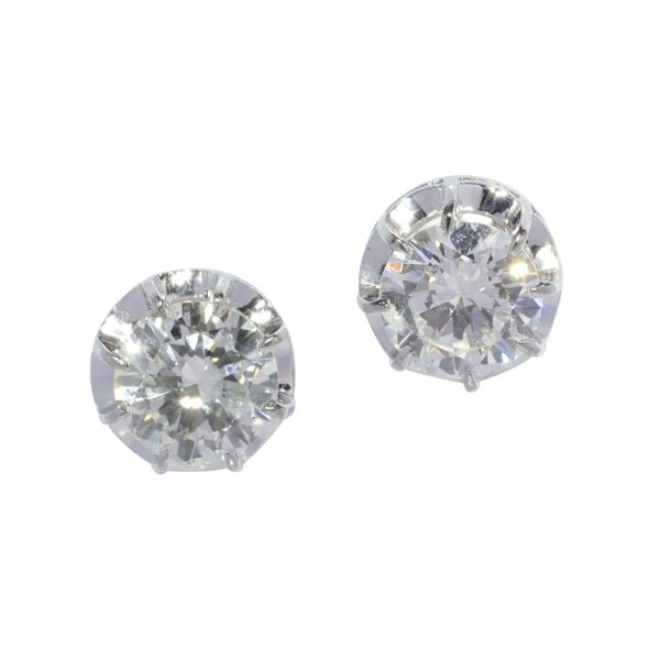 Vintage brilliant cut diamond stud earrings set in platinum circa 1950. Total diamond weight 2.40 carats.