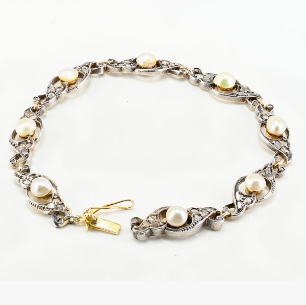 Edwardian Antique Natural Pearl and Rose Cut Diamond Bracelet, openwork scroll links set with rose-cut diamonds around natural pearls in silver upon 18ct yellow gold. Circa 1905