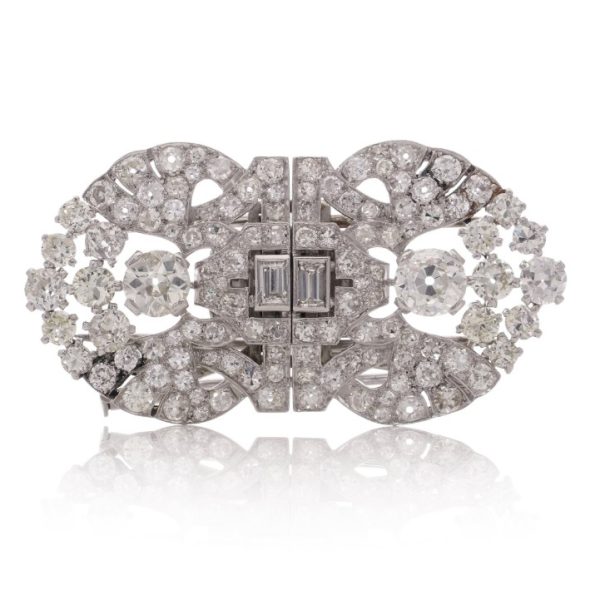 Antique Art Deco 5.52ct Diamond Double Clip Brooch, set with 5.52 carats of old-cut, baguette, and round brilliant diamonds