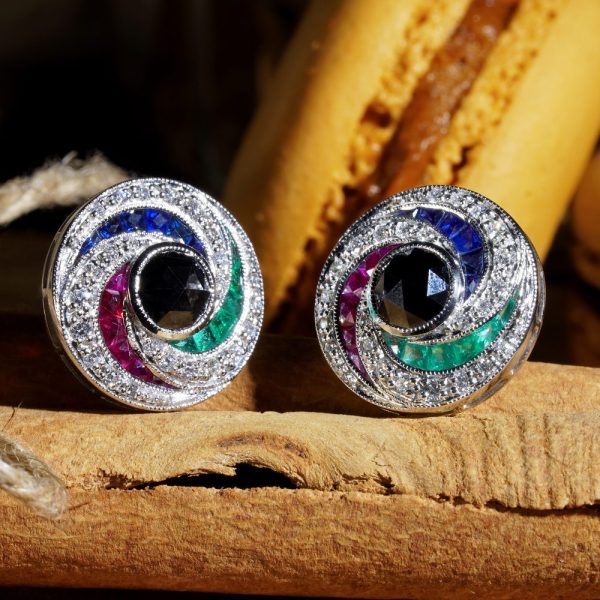 Black Diamond and Multi Gemstone Swirl Cluster Stud Earrings, round rose-cut black diamonds surrounded by French-cut rubies, sapphires and sparkling white round brilliant-cut diamonds in pin-wheel design in 14ct white gold
