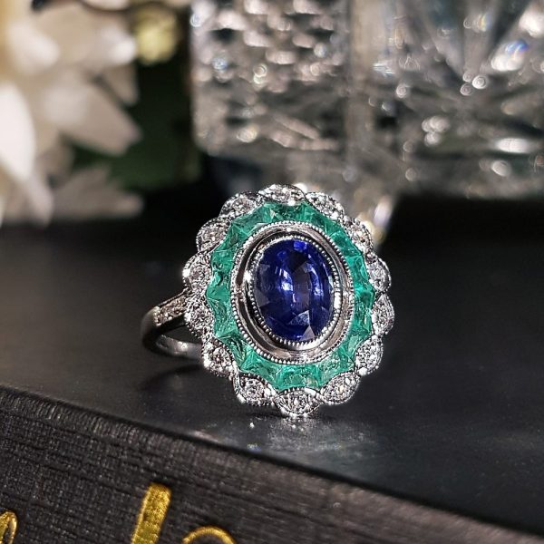 1.50ct Oval Ceylon Sapphire with Emerald and Diamond Cluster Engagement Ring